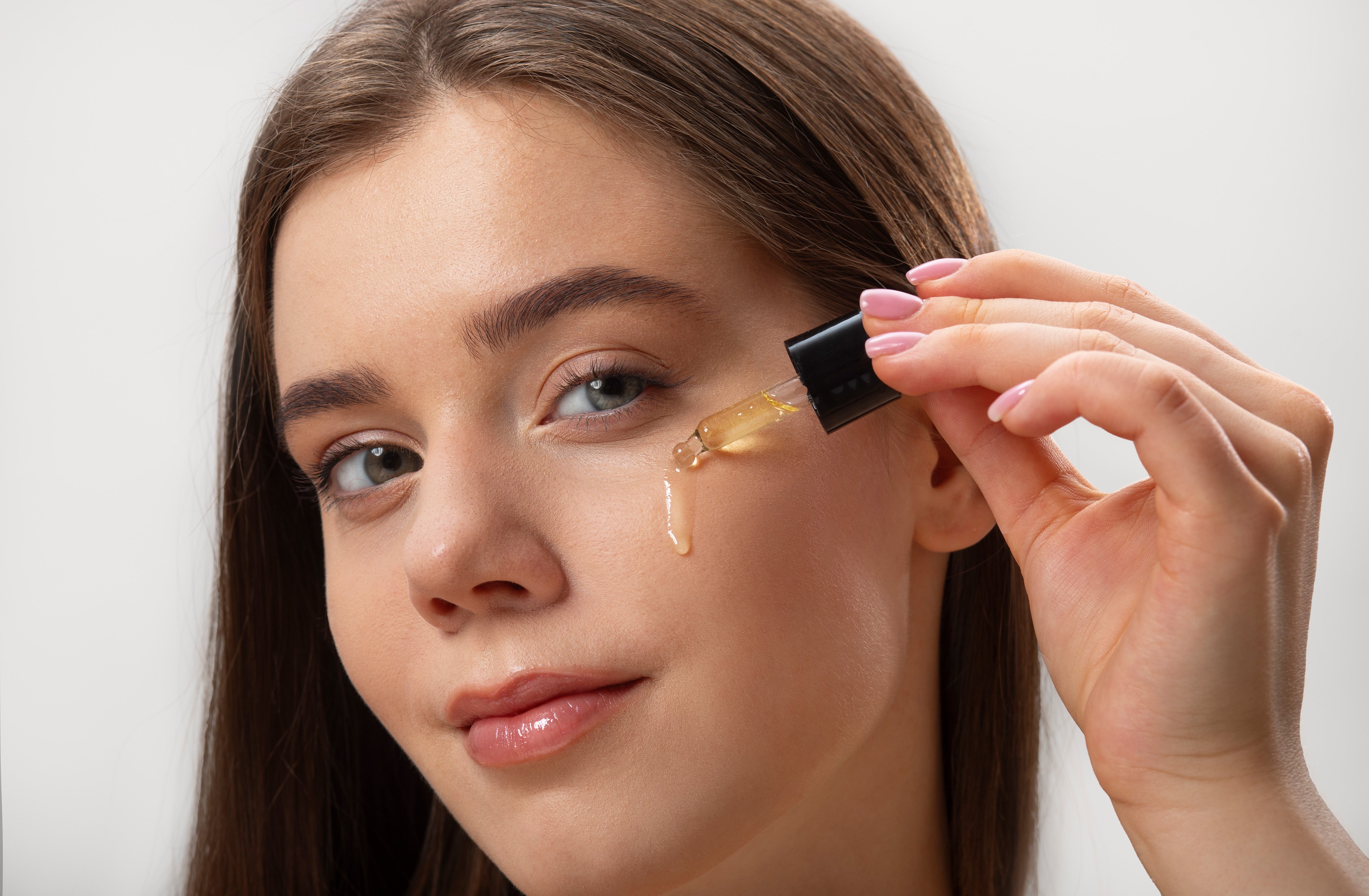 side-view-young-woman-using-serum.jpg
